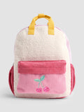 Medium-sized children's teddy fleece backpack in a cherry blossom pink and cherry red color-block design